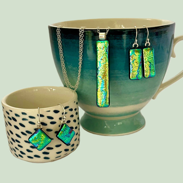 New for 2024 A dazzling and unique design in dichroic drop earrings.