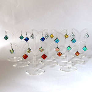 New for 2024 A dazzling and unique design in dichroic drop earrings.