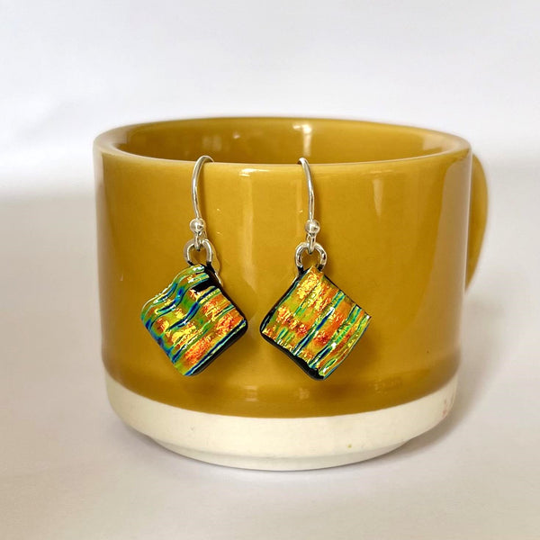 New for 2024 A dazzling and unique design in dichroic drop earrings.