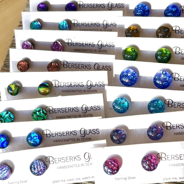 Stud Earrings in Dichroic glass, displayed on wildflower seeded card.