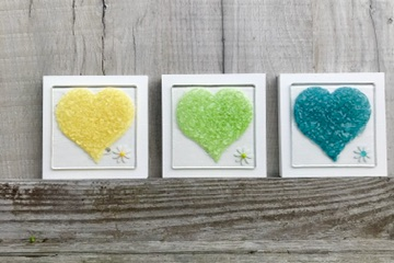 Berserks Glass Fused Glass Country Sweetheart Daisy Wall Art Set 3 Yellow, Lime and Jade 12cm by 12cm each. Raised colourful hearts with coordinating daisy, mounted and ready to hang.