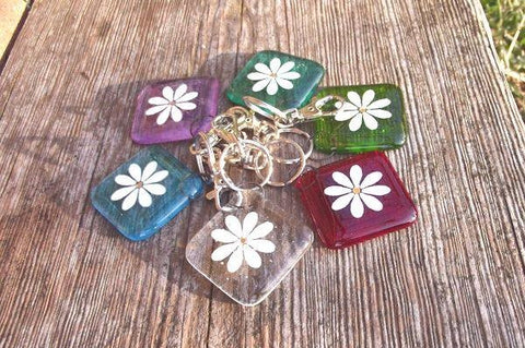 Berserks fused glass keyrings in 6 colours decorated with single white daisy